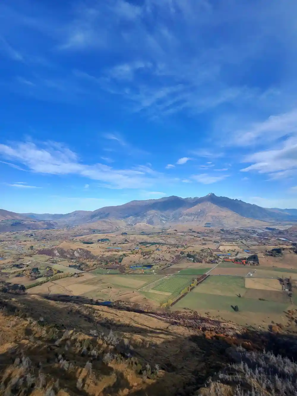 Mountains and patchwork farmland seen from the air