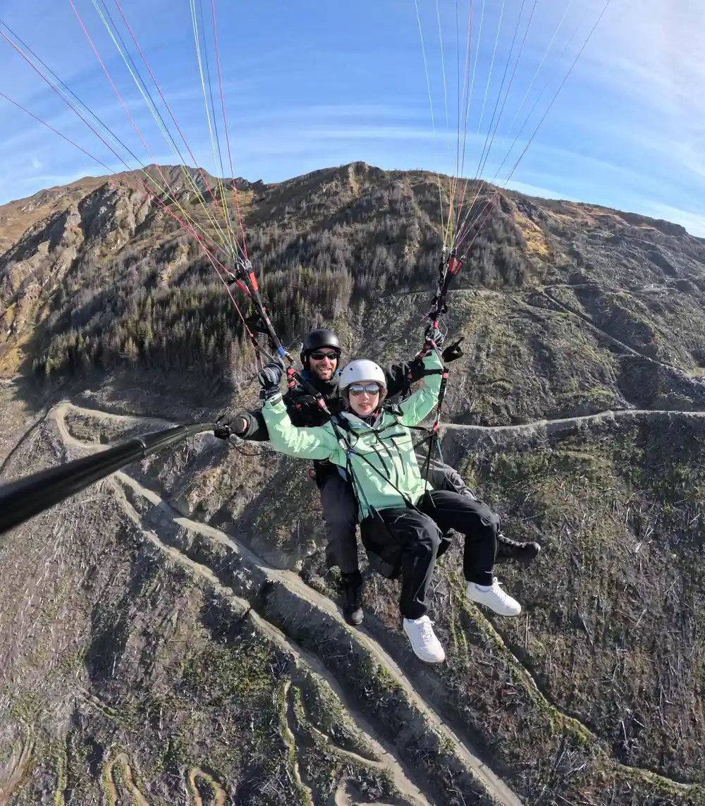 A tandem crossing a bare rocky slope